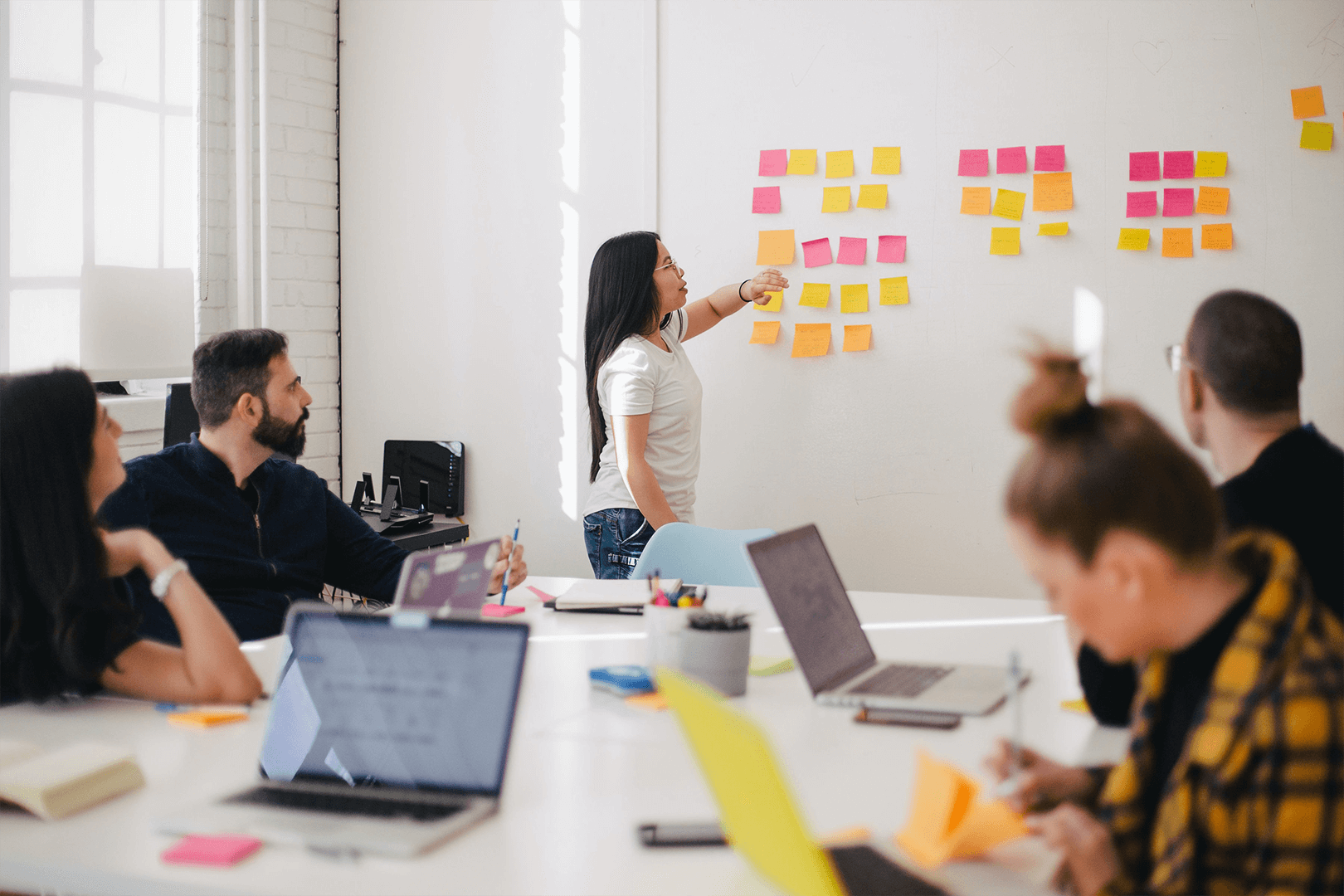 discussing notes on a whiteboard