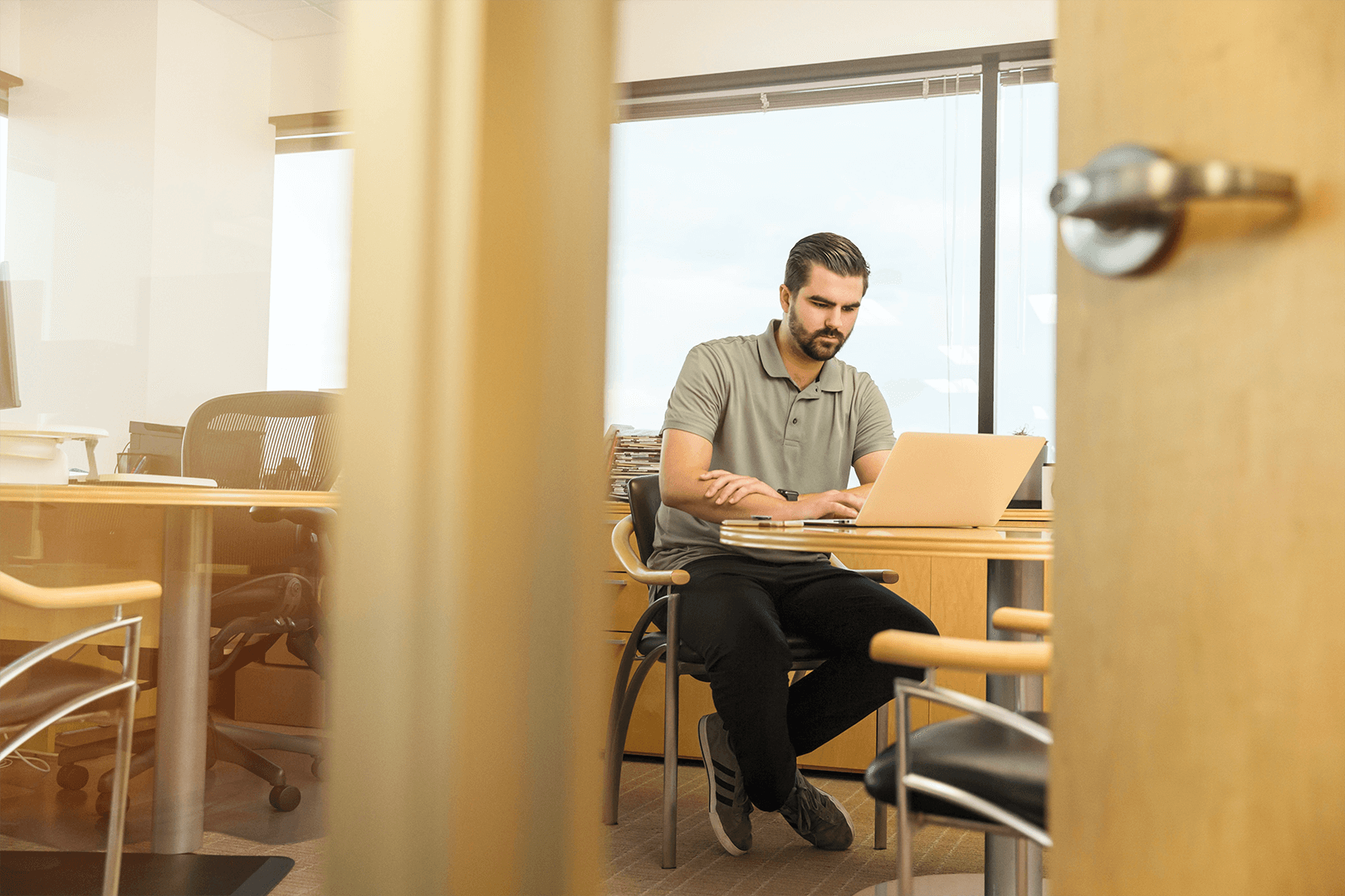 Man using laptop in office